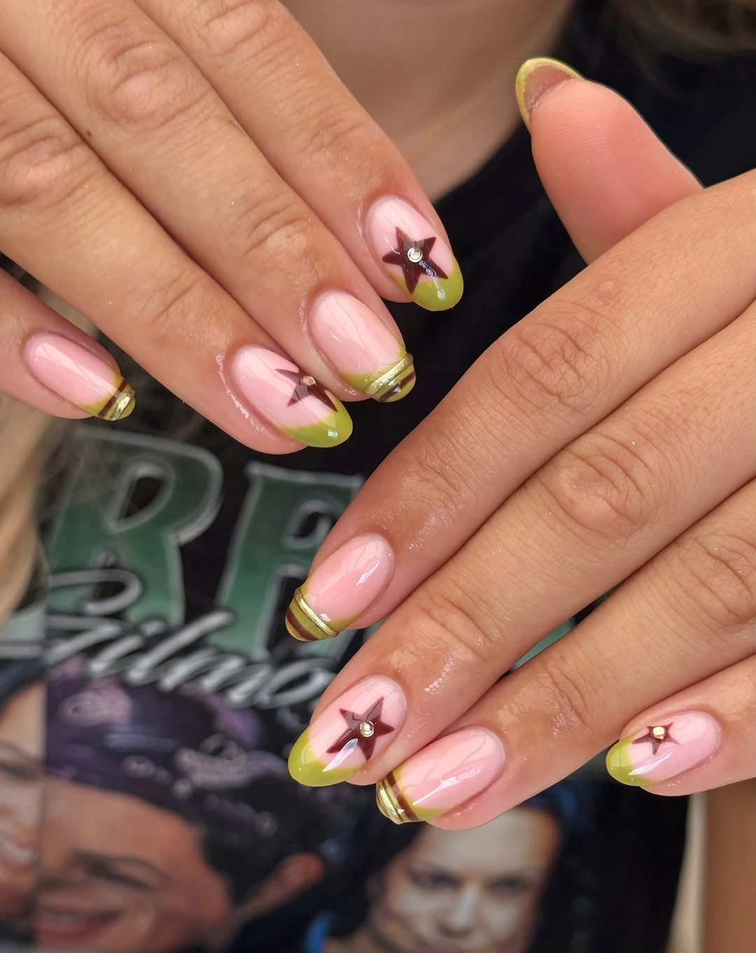 pink medium almond nails with checks, swirls, charms