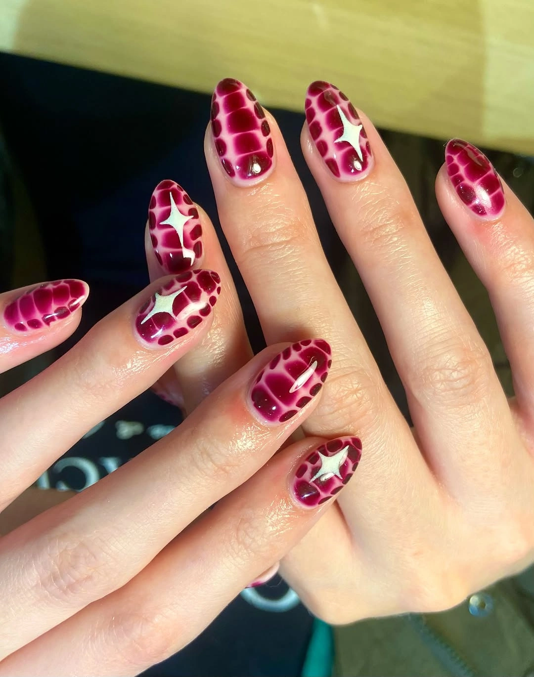 sky blue long pointed almond nails with contrasting dots