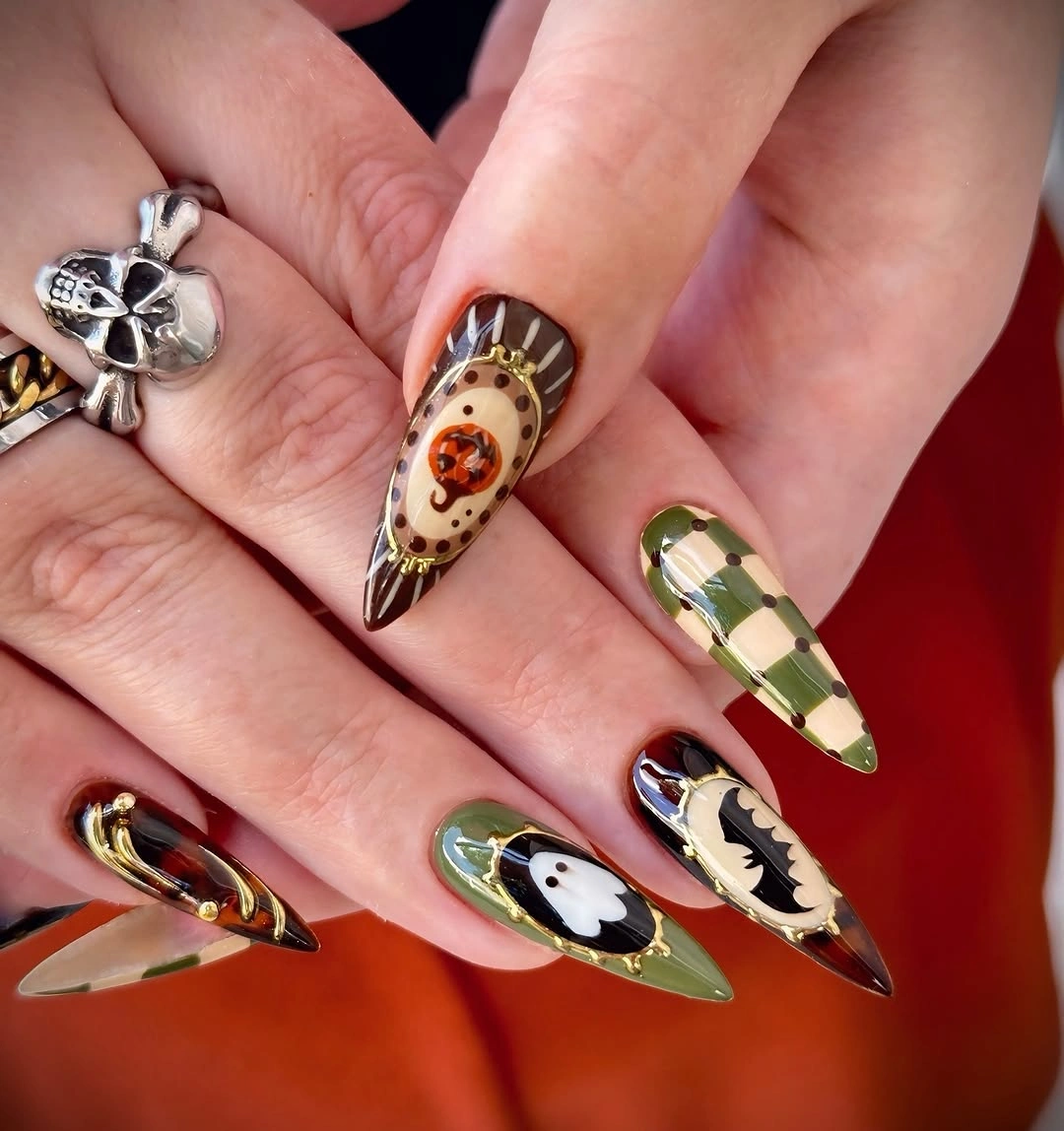 olive green long pointed almond nails with checkerboard and illustrated accents