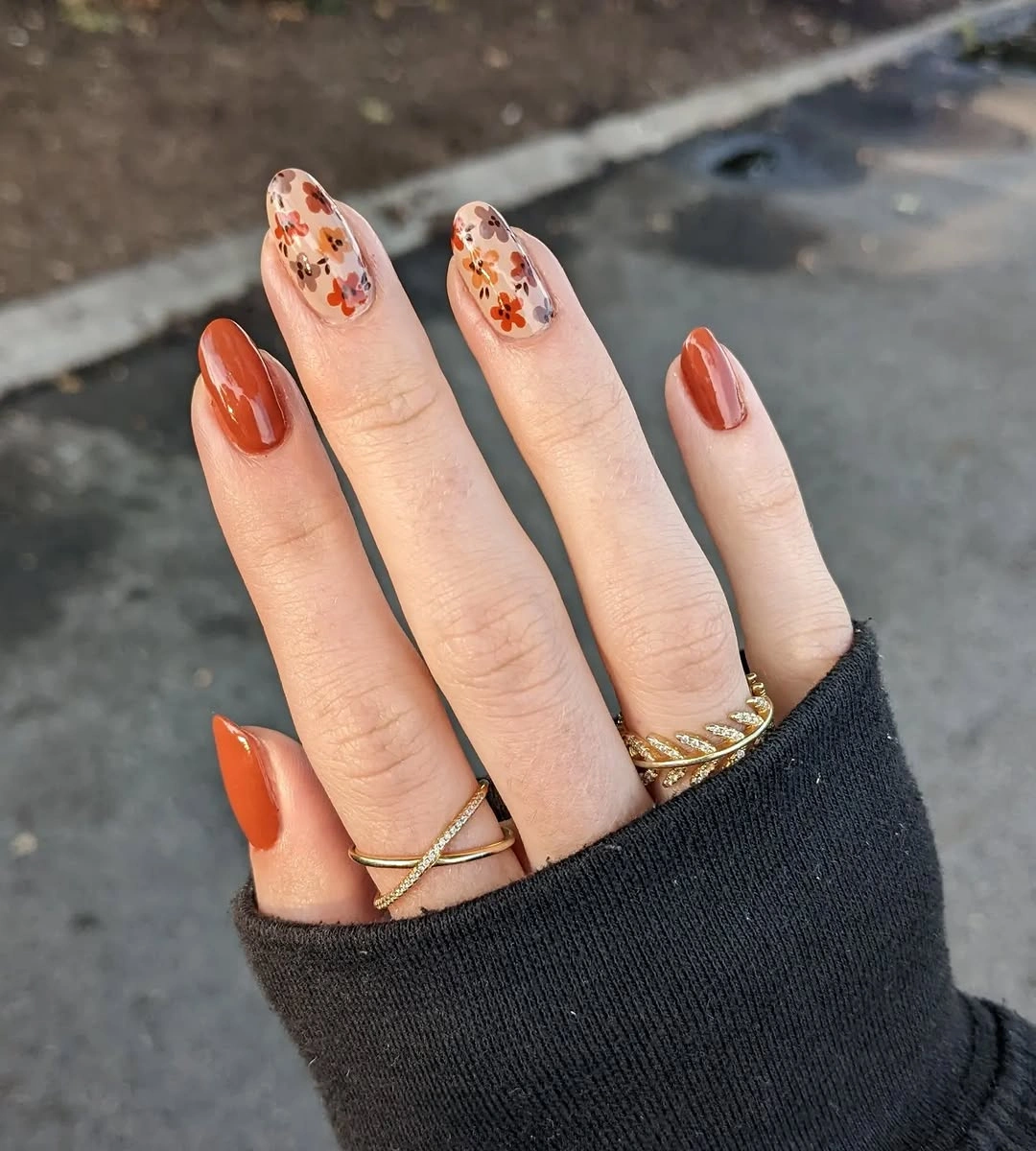 nude medium oval nails with flowers and leaves