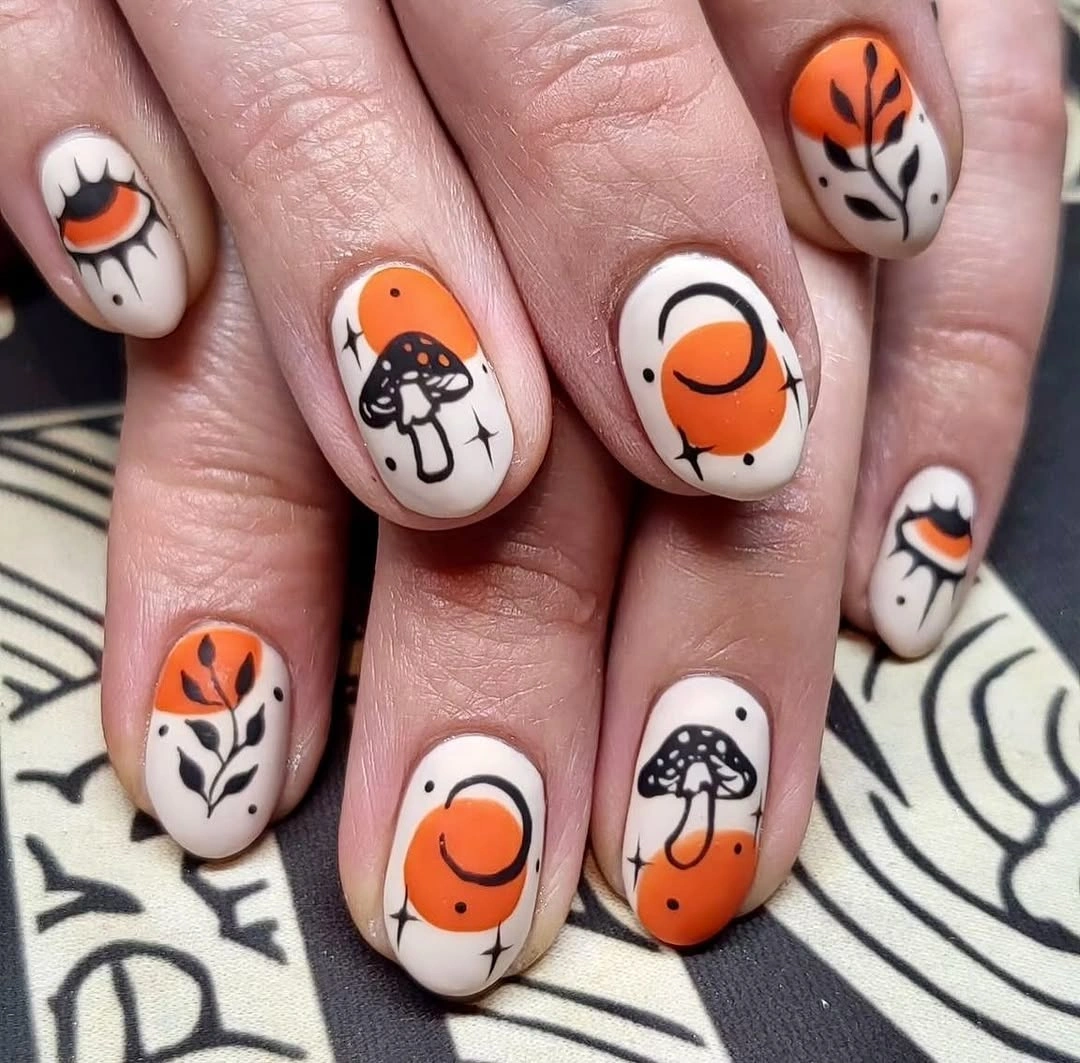 cream short rounded nails with pumpkins, mushrooms, leaves
