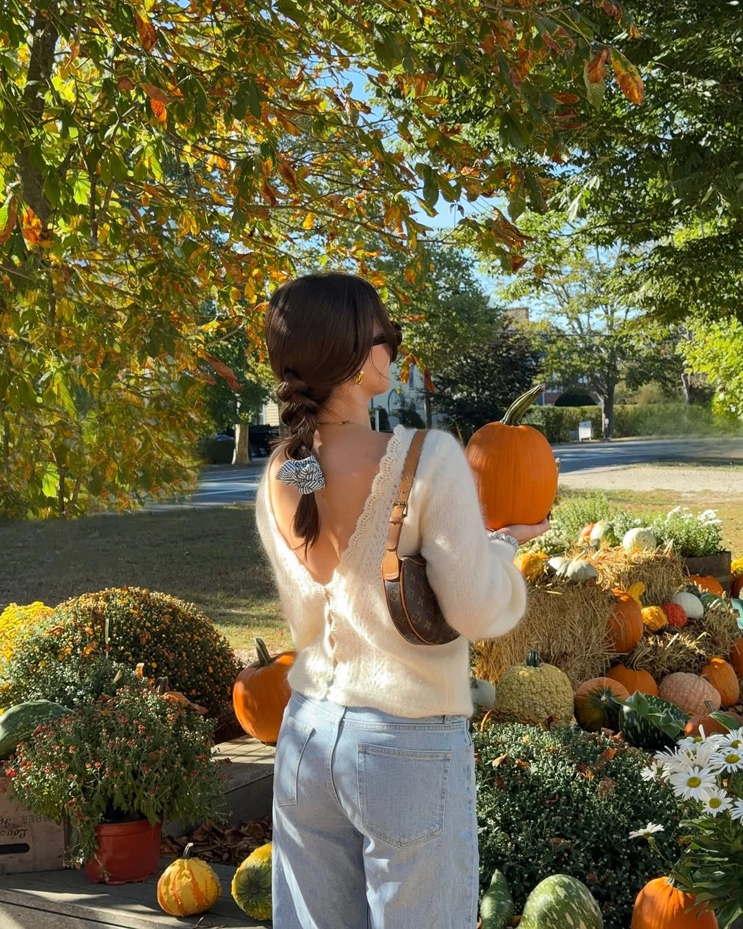 cream outfit with relaxed knit over straight or loose light denim