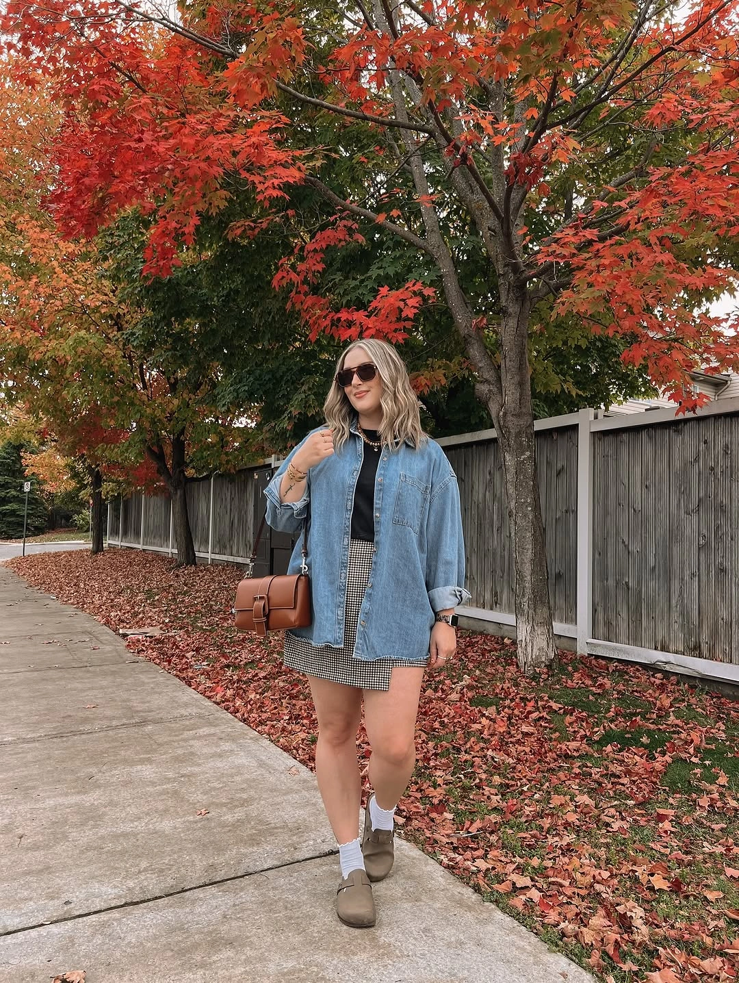 blue outfit with short denim jacket over mini skirt with ankle boots