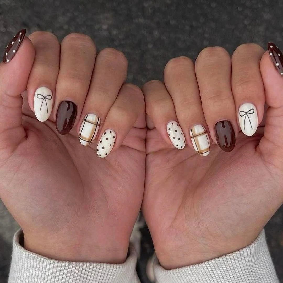 Brown and white oval nails with bows dots and plaid