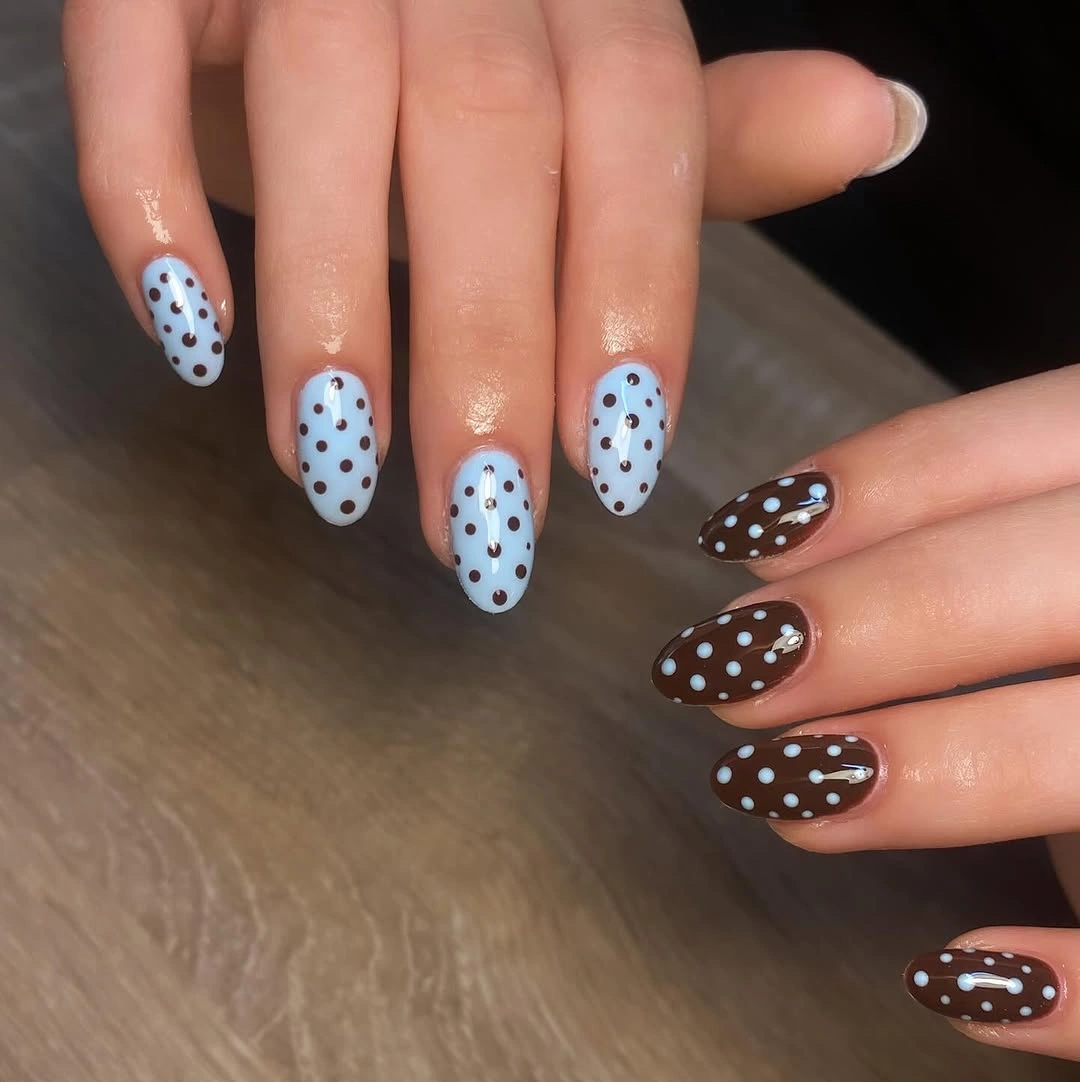 Blue and brown oval nails with exchanged dot colors