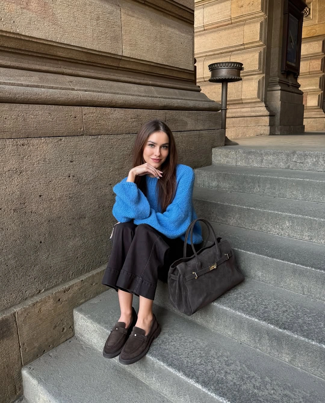 Cobalt sweater with dark midi skirt and black tote