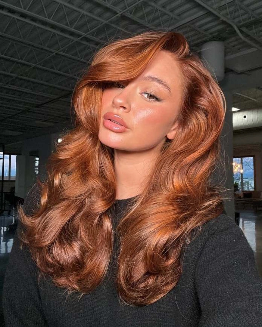 Long copper hair with wide face-framing waves