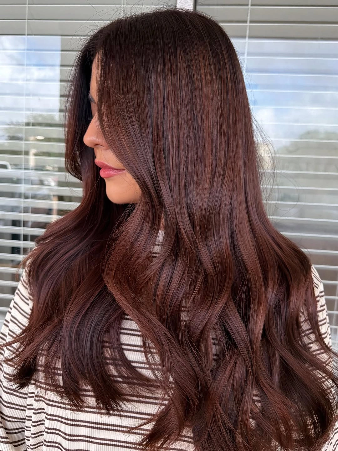 Long chocolate waves with soft face-framing layers