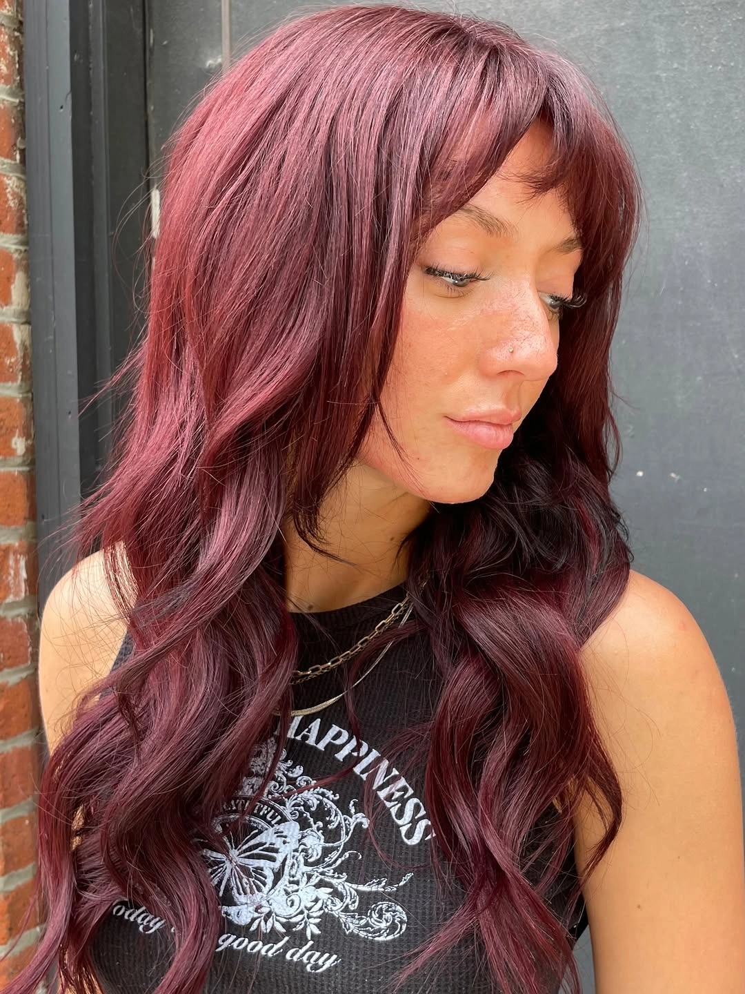 Long dusty rose hair with loose waves and soft part