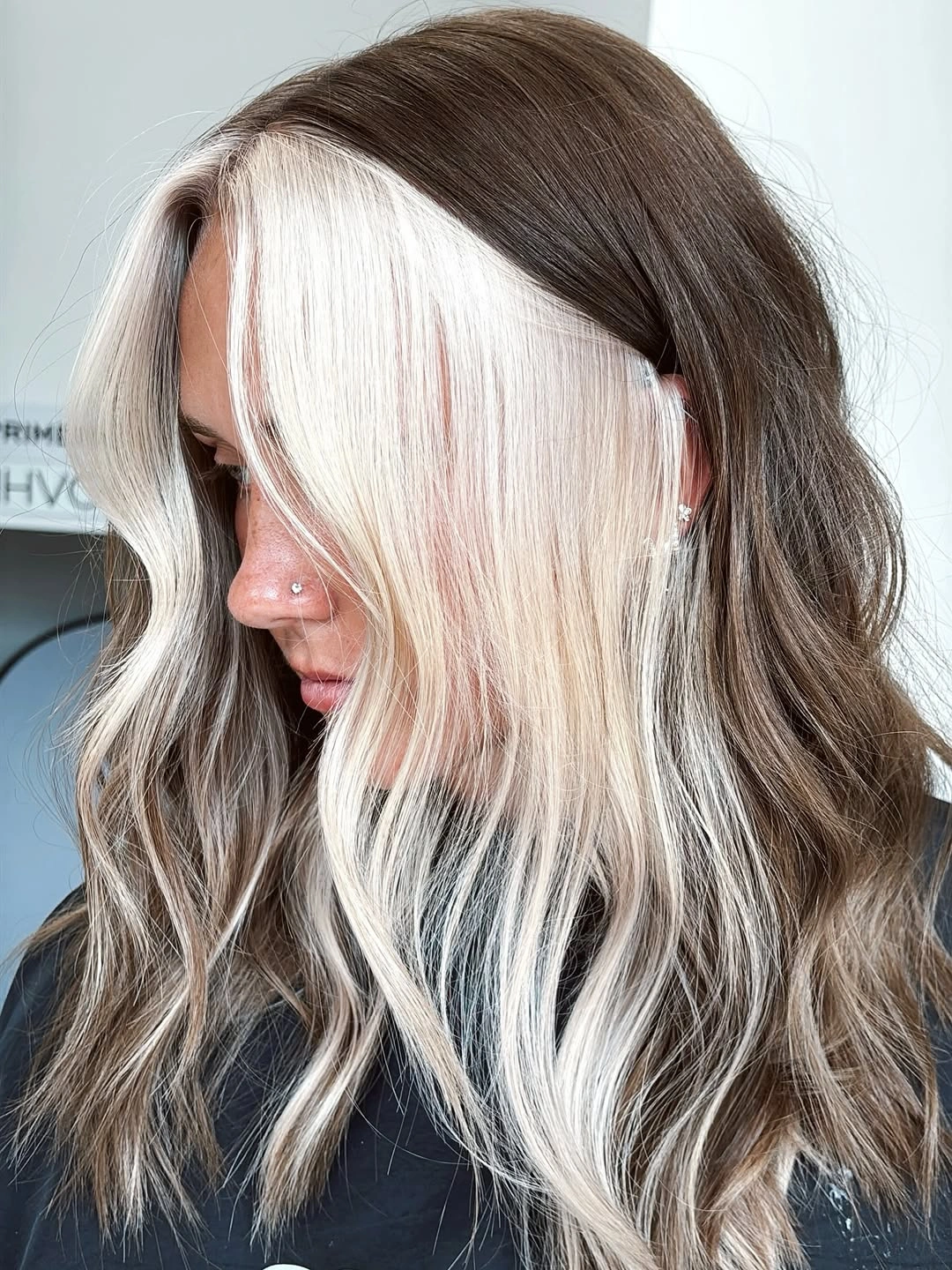 Long dark waves with a pale blonde face frame
