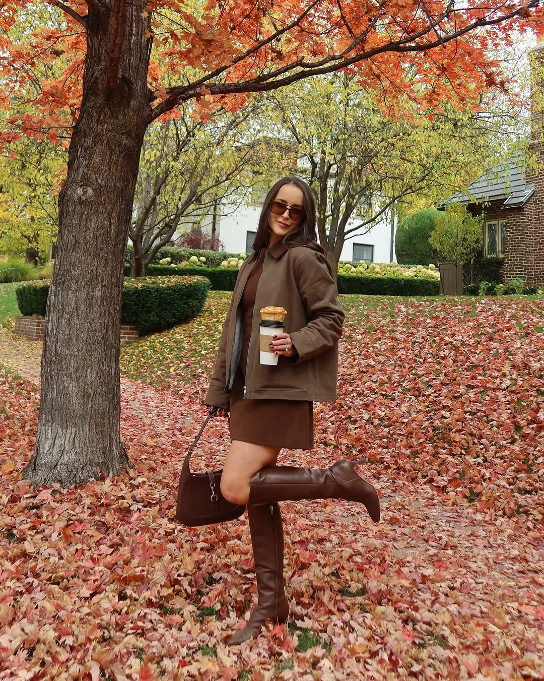 Olive jacket and mini skirt with tall brown boots