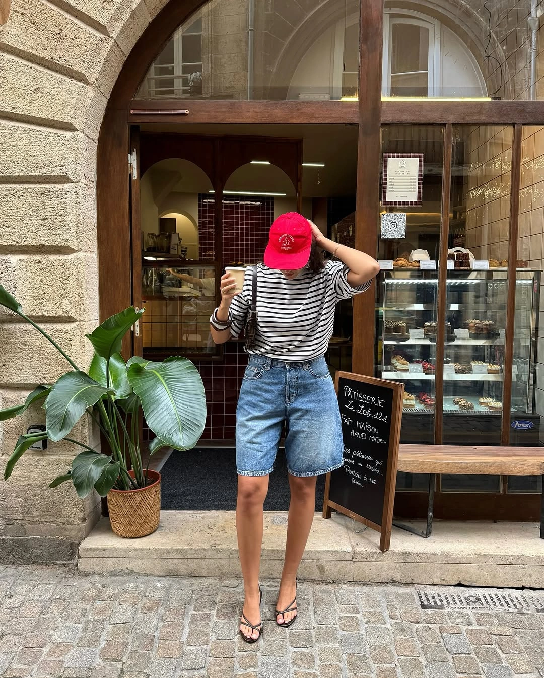 Striped tee with denim shorts and red accessories
