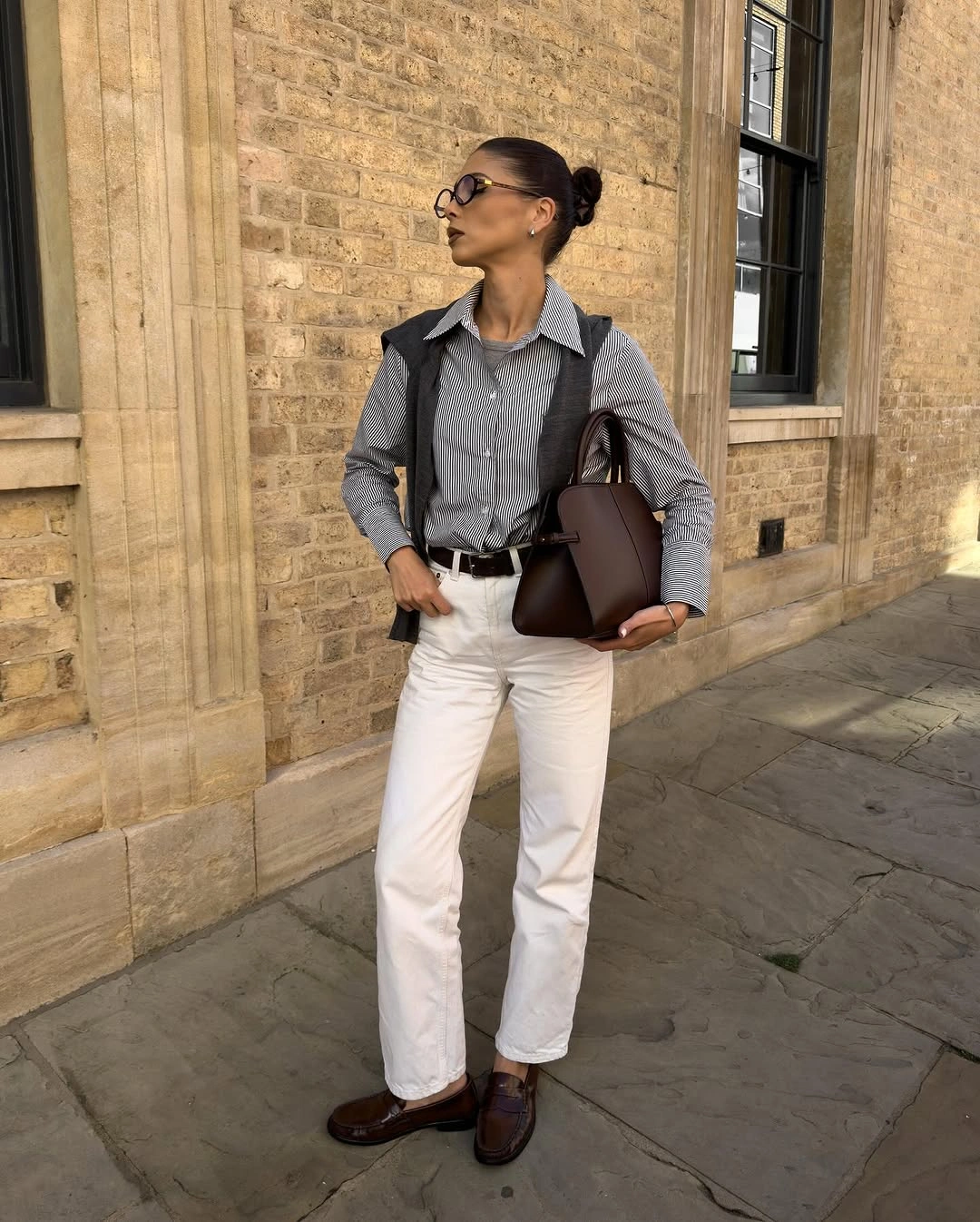 Gray button-down with white trousers and brown accessories
