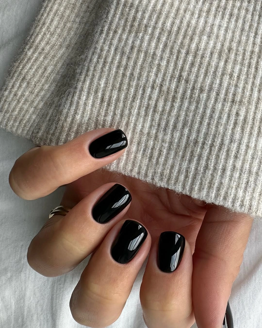 short rounded glossy black nails