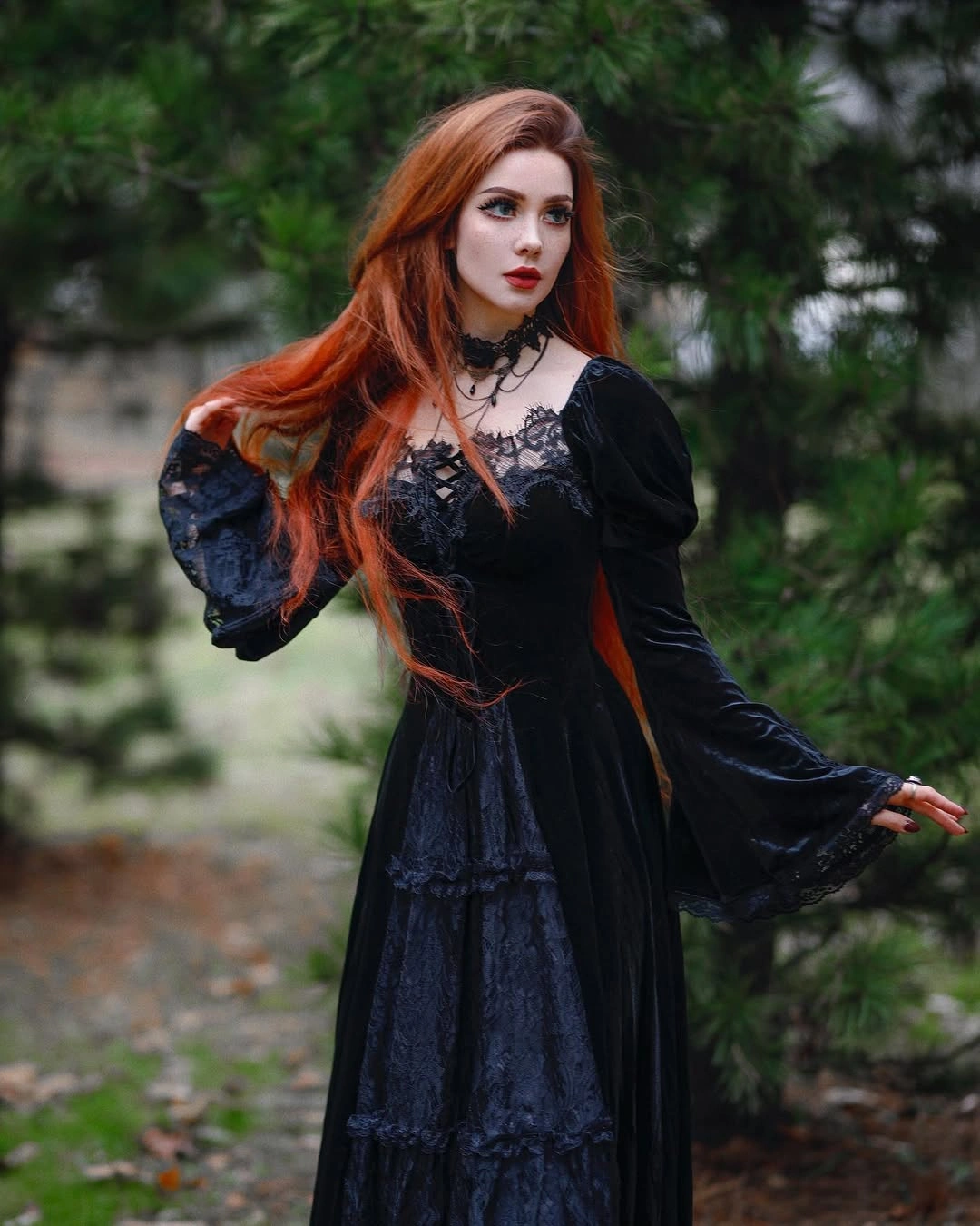 black outfit with long fitted-to-flared dress with bell sleeves