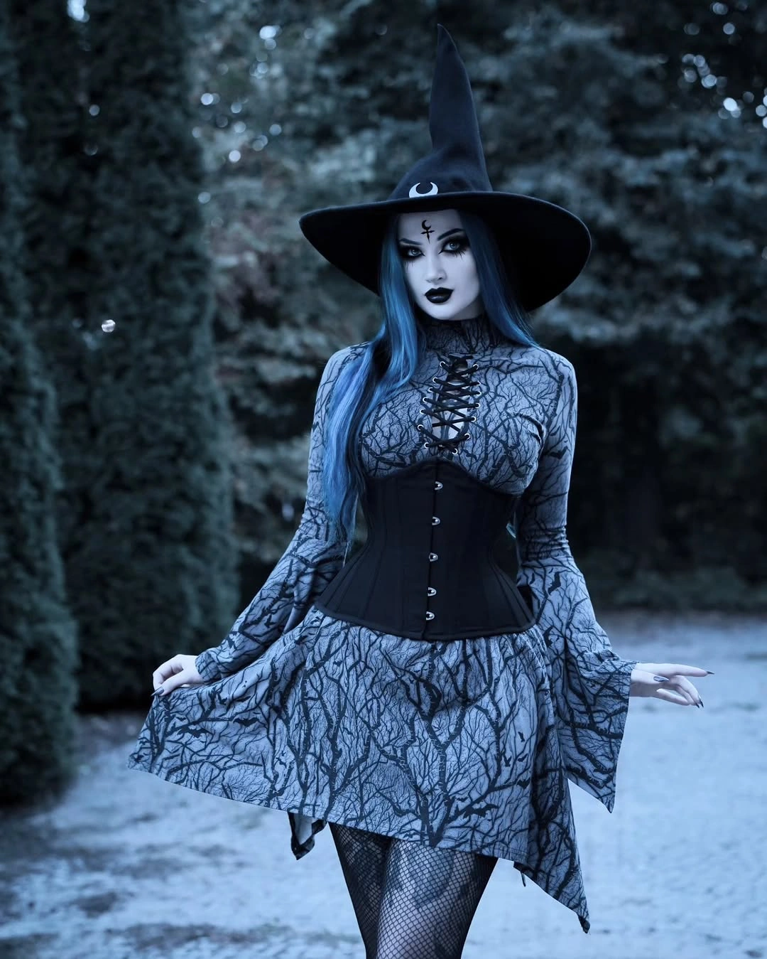 charcoal outfit with fitted corset center with flared printed skirt and pointed hat