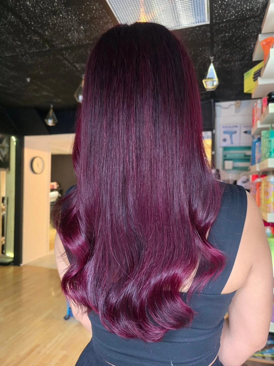 Long dark burgundy hair with plum and magenta undertones