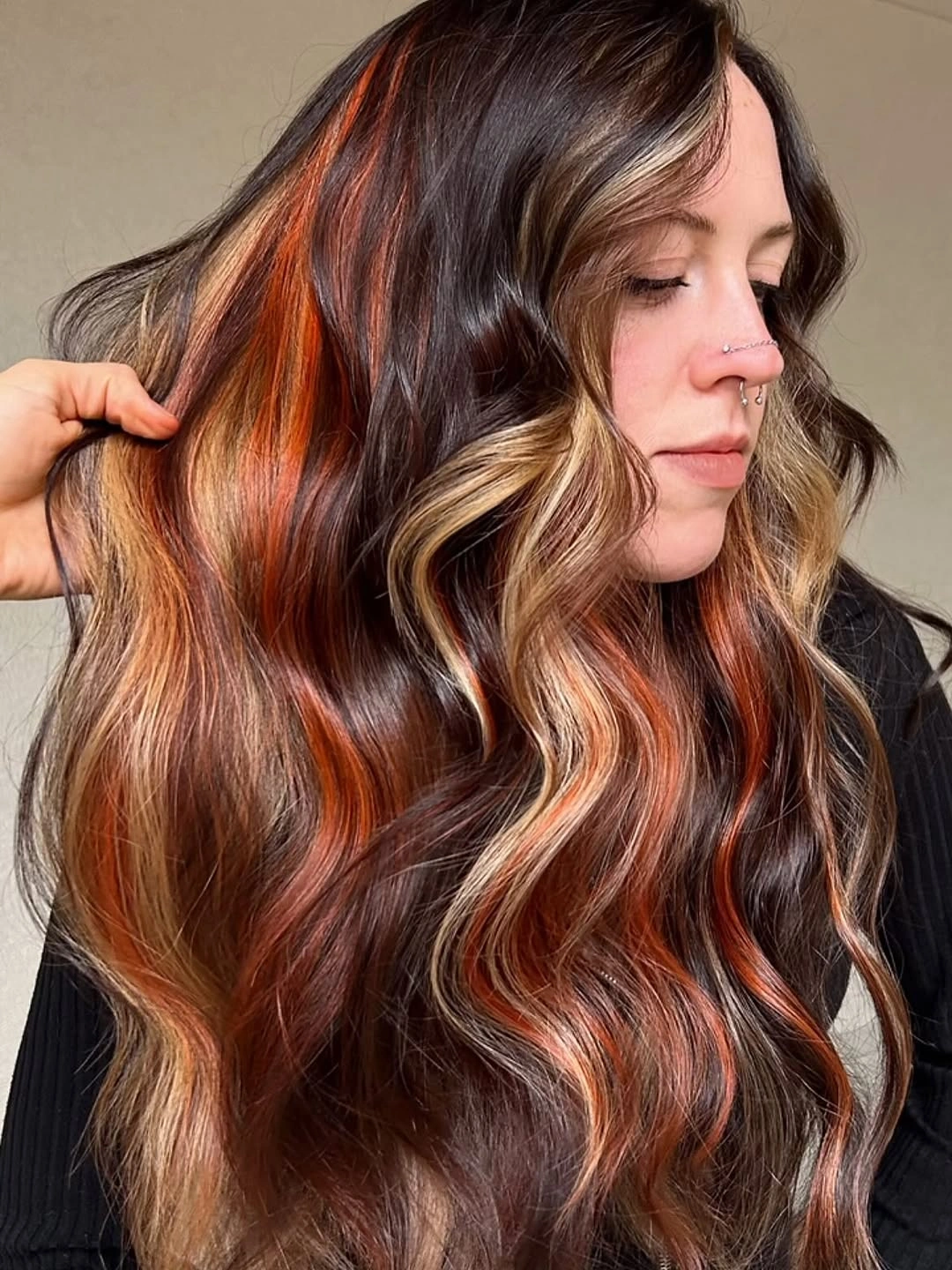 Dark brown waves with copper-orange and pale blonde ribbons