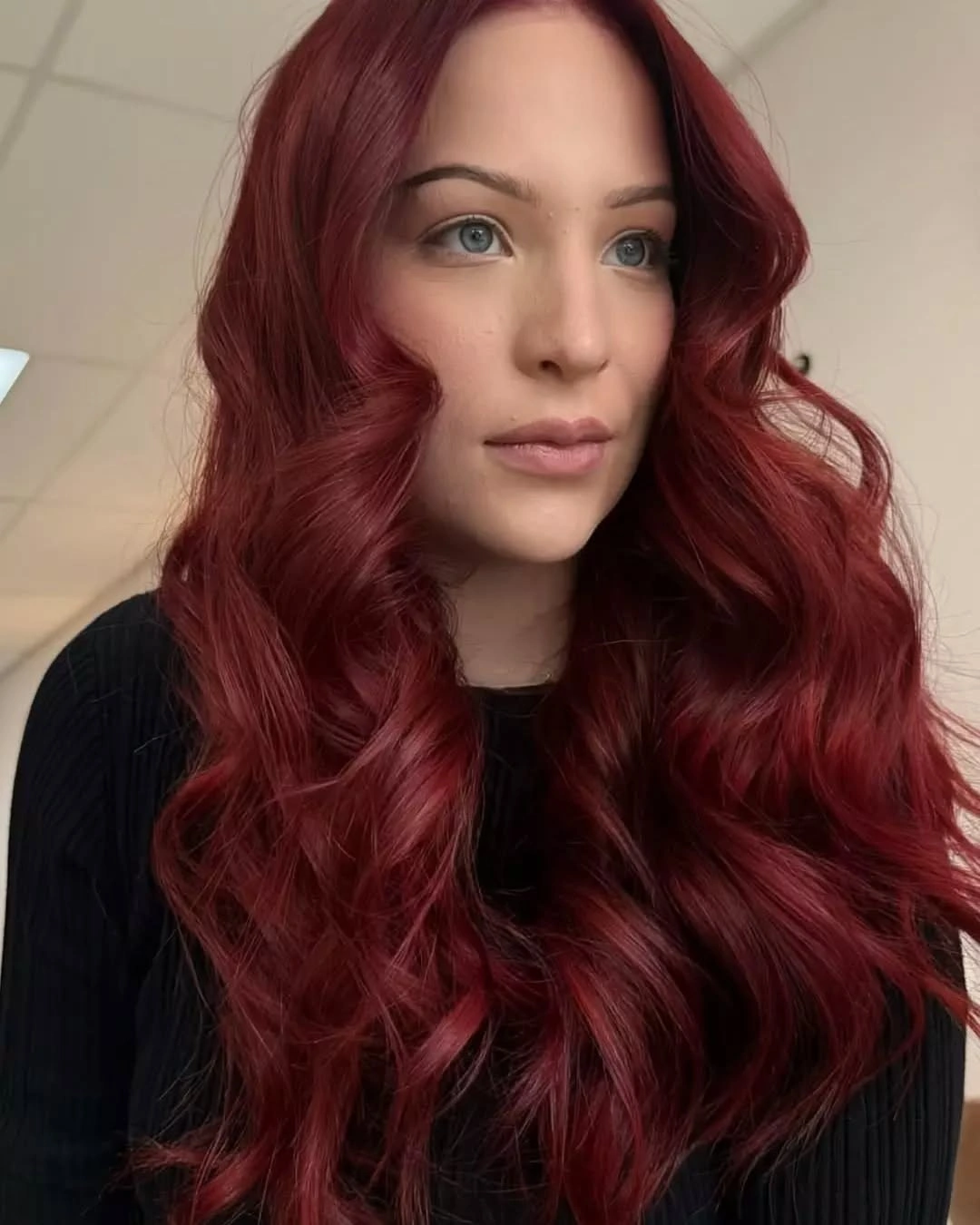 Long cherry-red waves with rich saturated color throughout the length