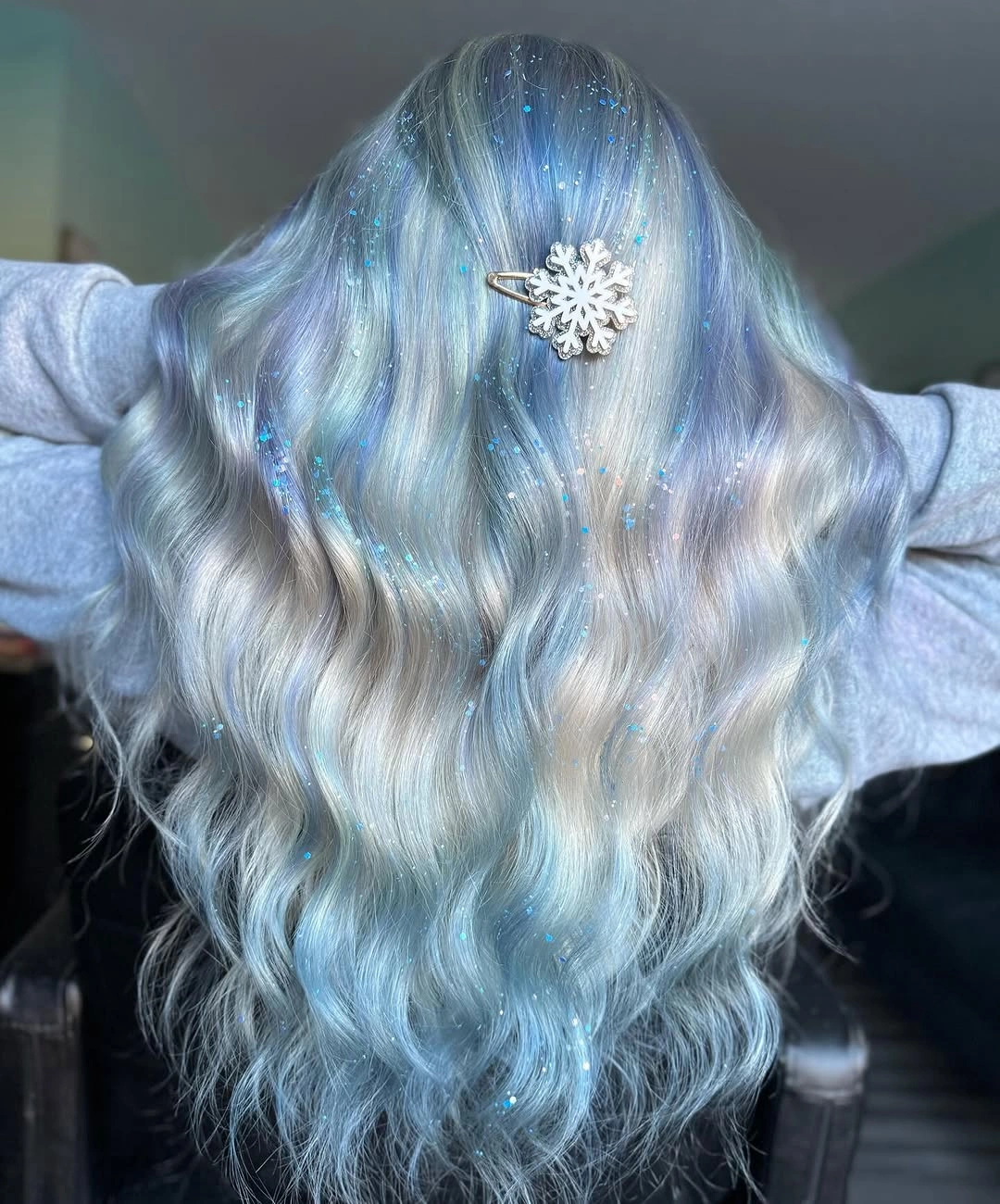 Long icy silver waves with pale and brighter blue sections