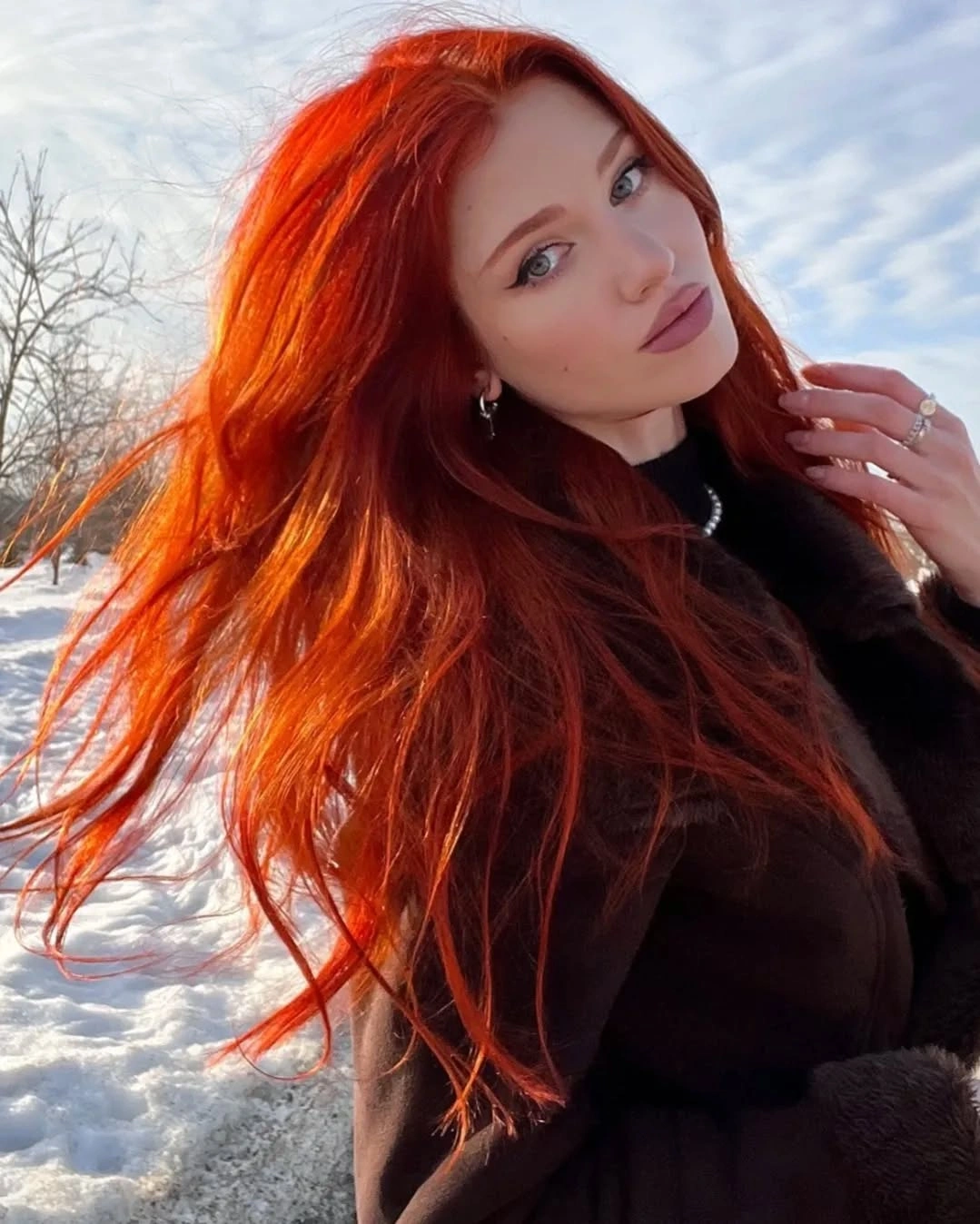 Long scarlet-copper hair with intense red-orange saturation throughout