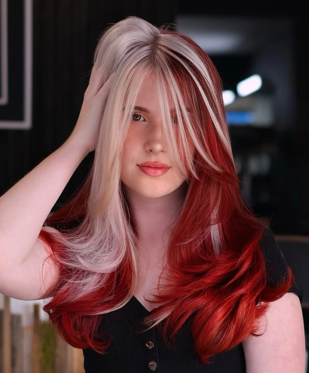 Long layered red and pale blonde hair with sharp contrast