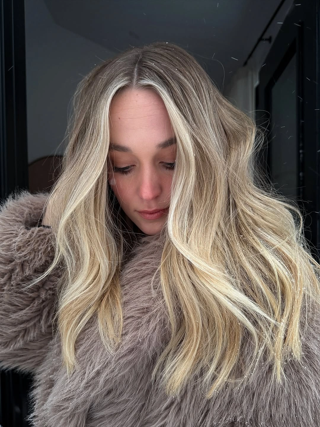 Very long layered hair with loose waves and face framing