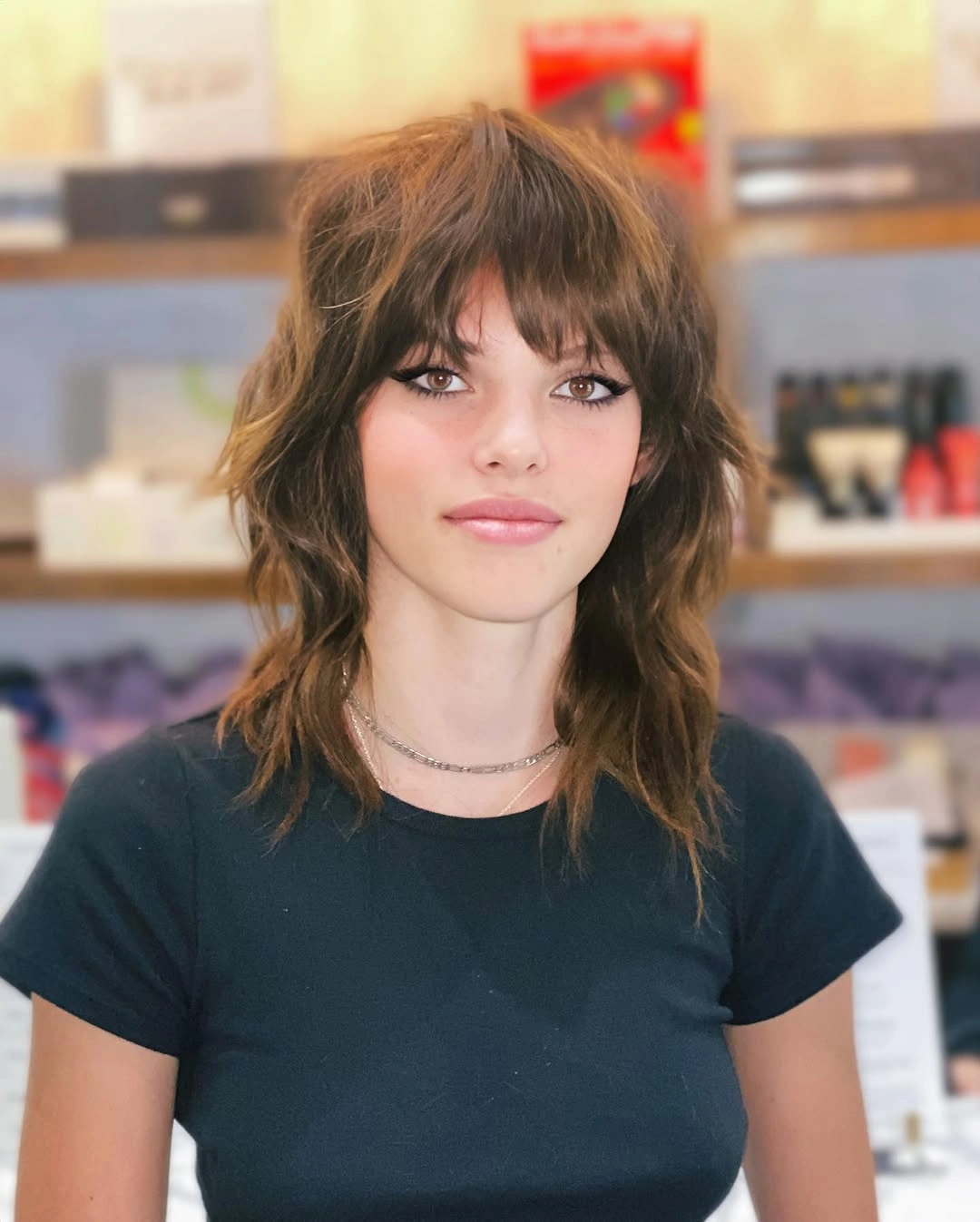 Medium piecey hair with choppy fringe and layered shoulder-length ends