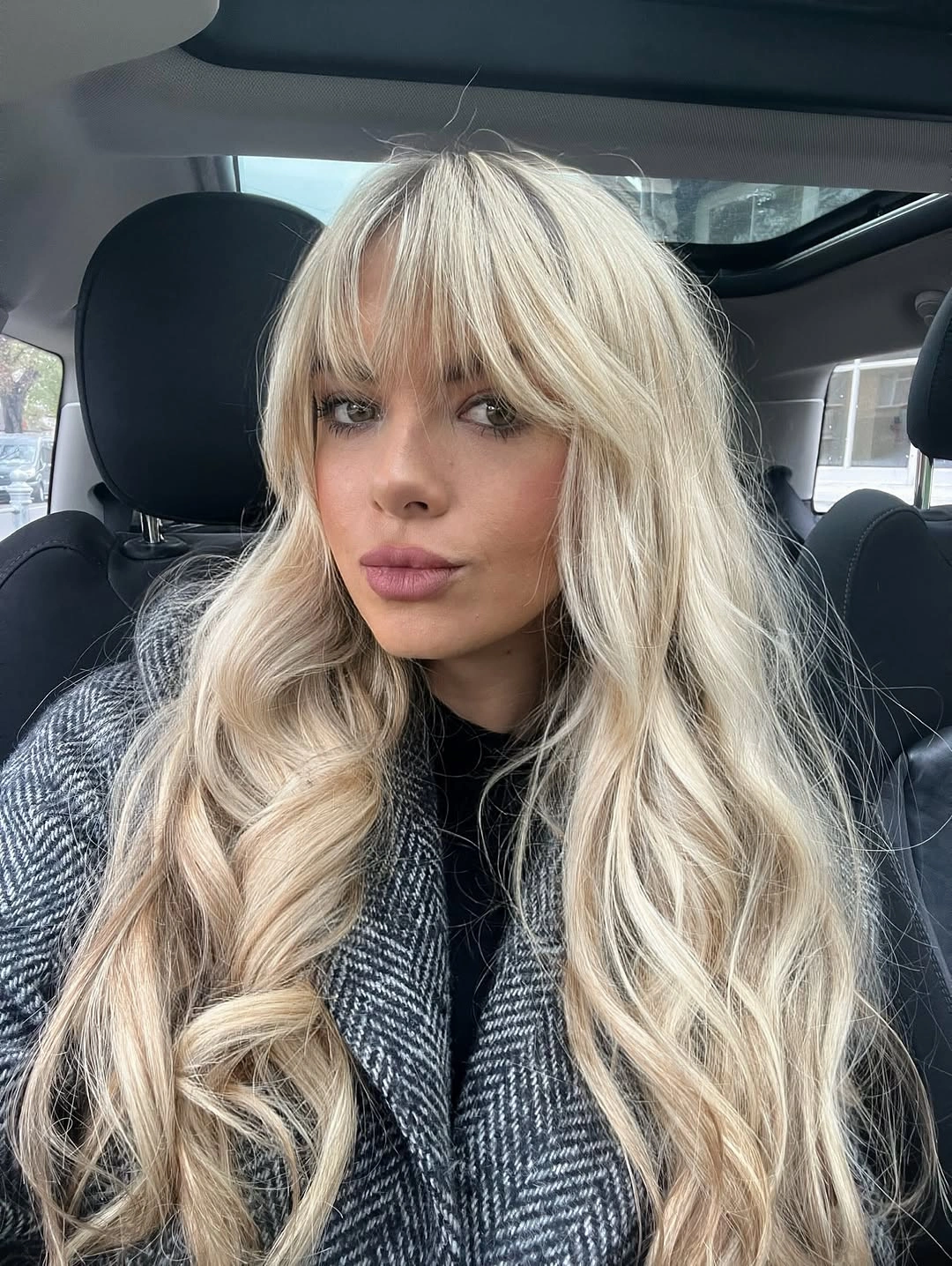 Very long wavy hair with soft full forehead fringe