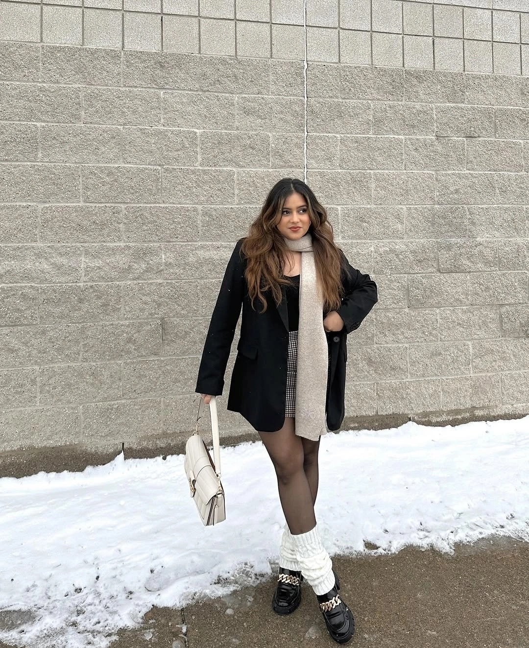 Black oversized layer, pale scarf, leg warmers, chunky loafers