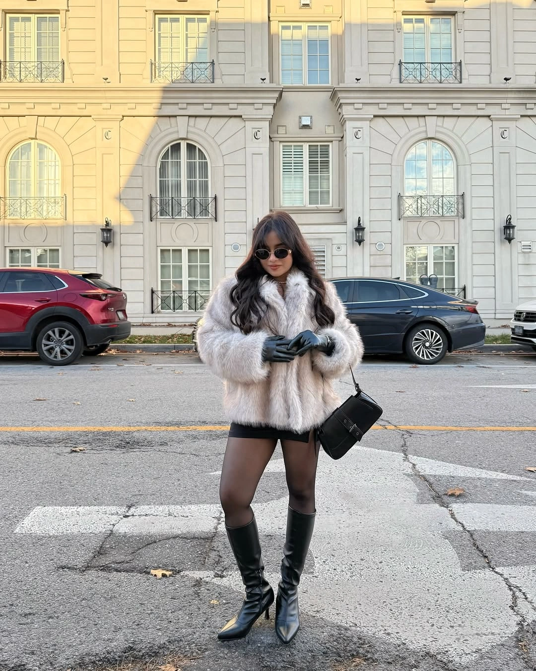 Light plush jacket, black mini skirt, tights, tall boots