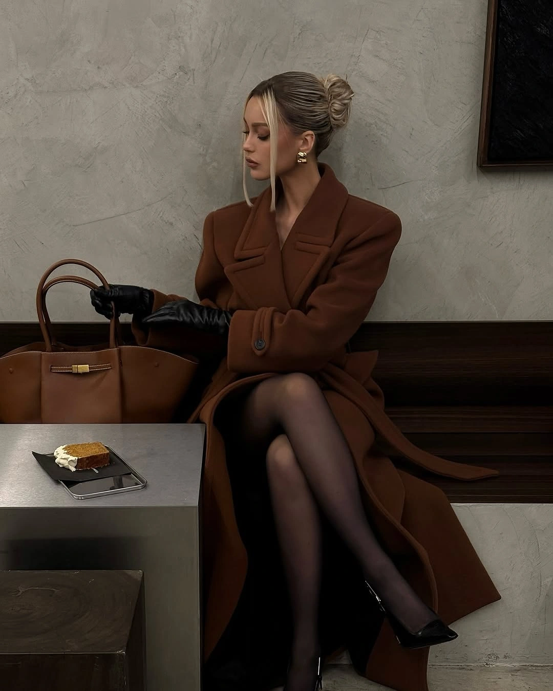 Brown tailored coat with black gloves, sheer tights, pointed shoes