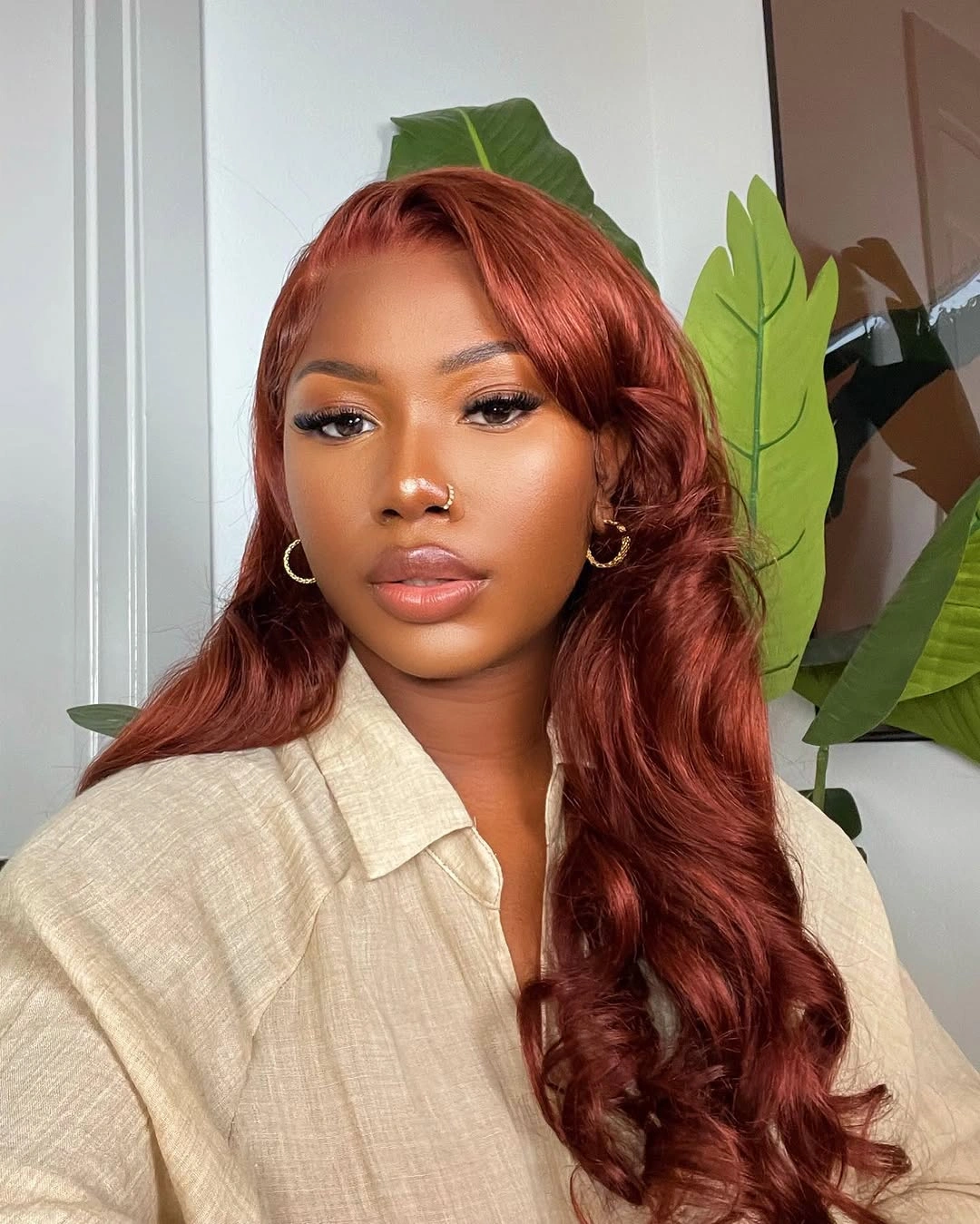 Long glossy copper red hair with loose side waves