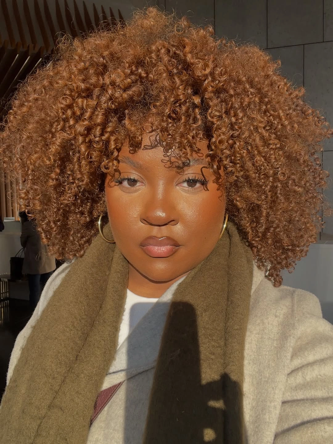 Rounded copper brown curls with scattered golden pieces