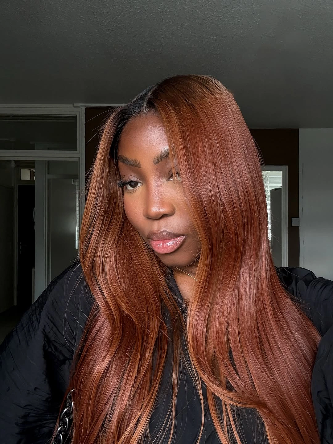 Long auburn copper hair with darker part area