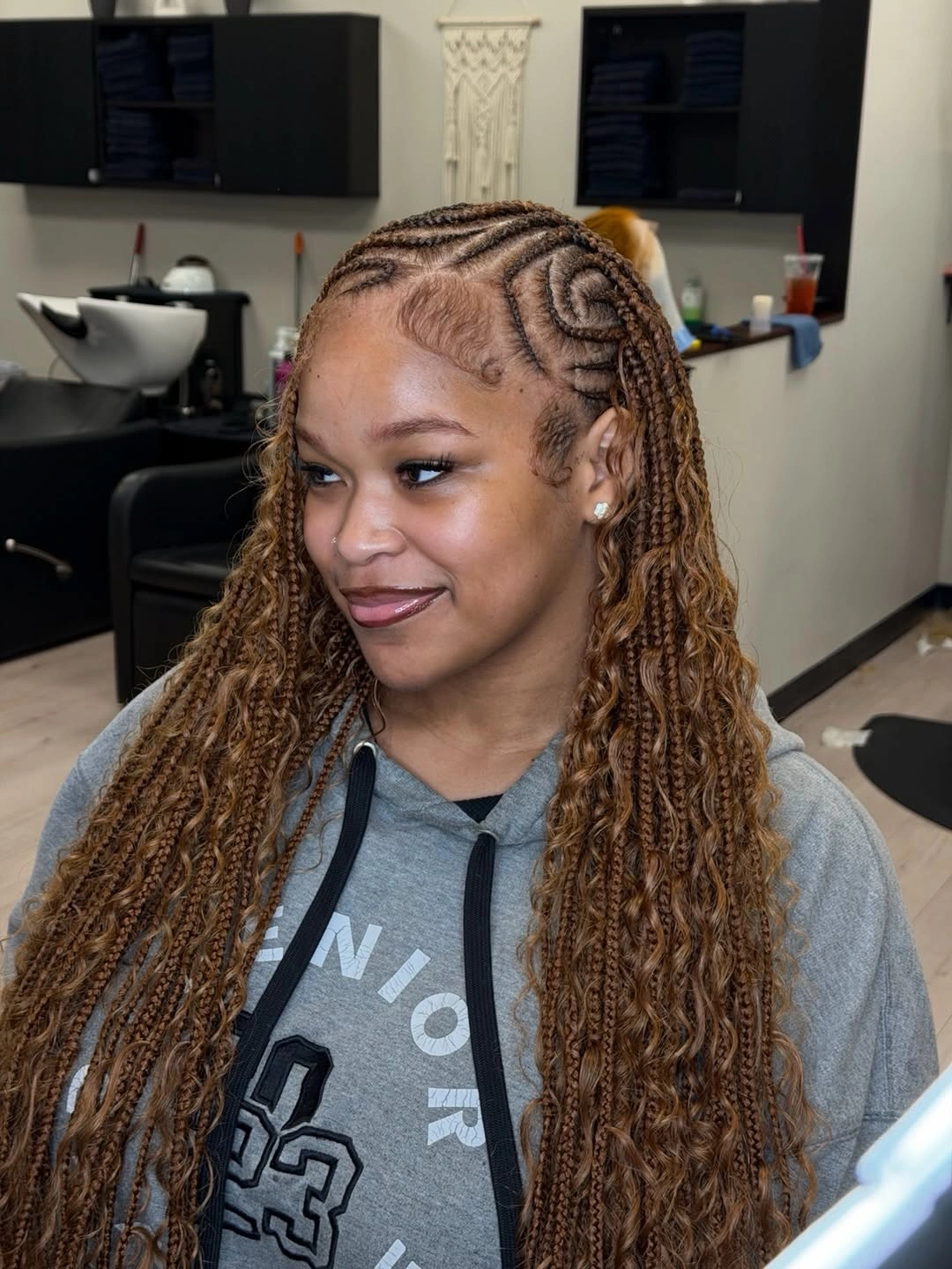 Long caramel brown braids with curved scalp-braided pattern