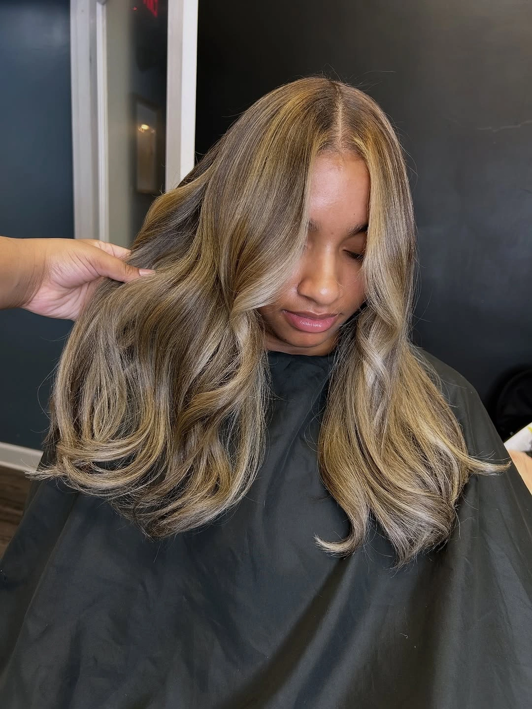 Long beige ash blonde waves with darker inner sections