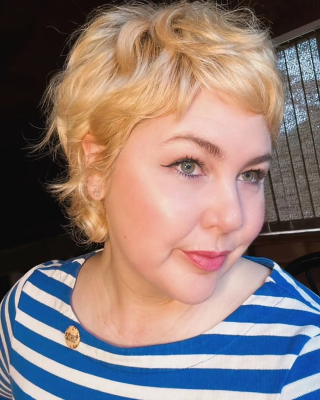 Tousled blonde short crop with soft bangs