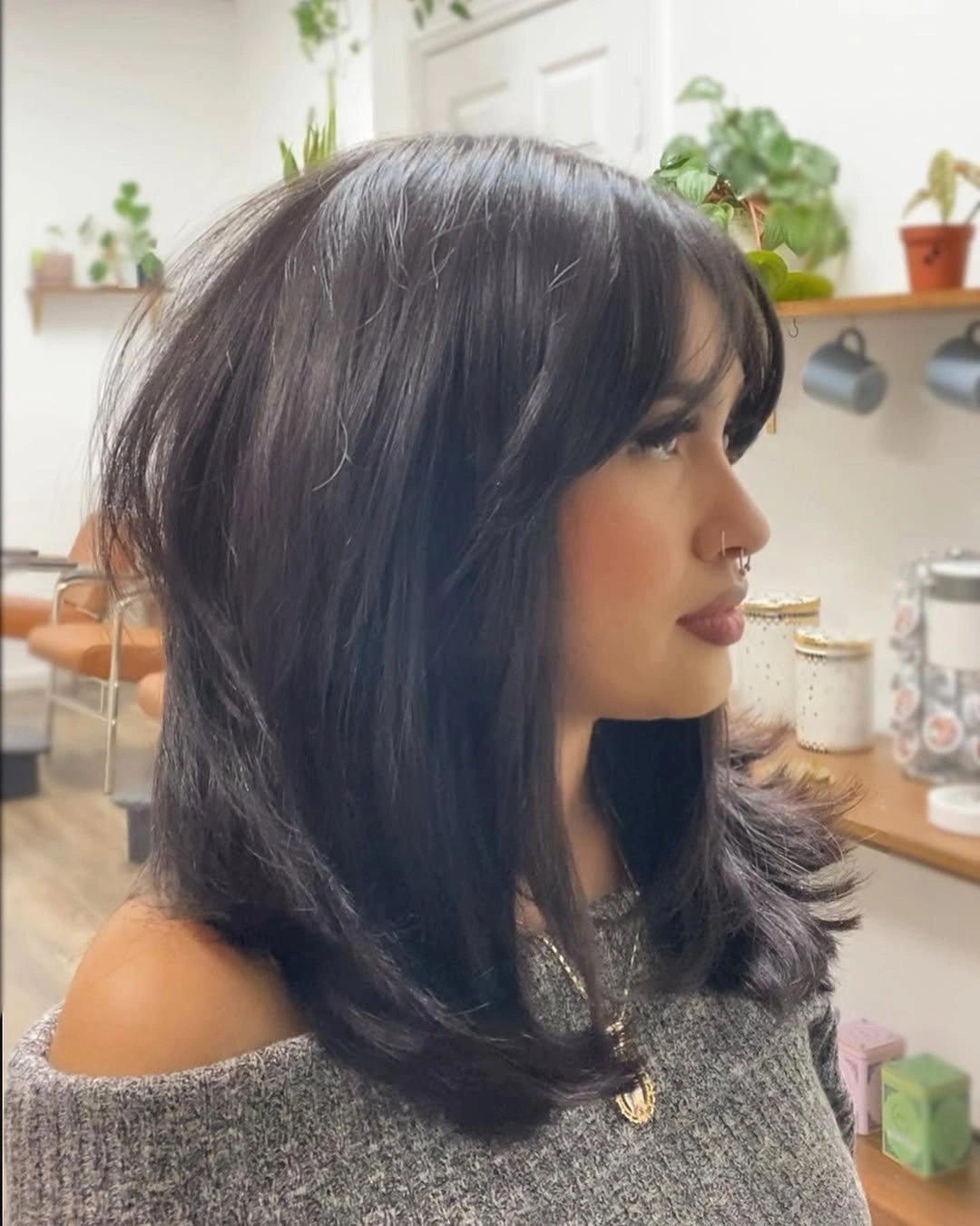 Dark shoulder lob with curtain fringe and flipped ends