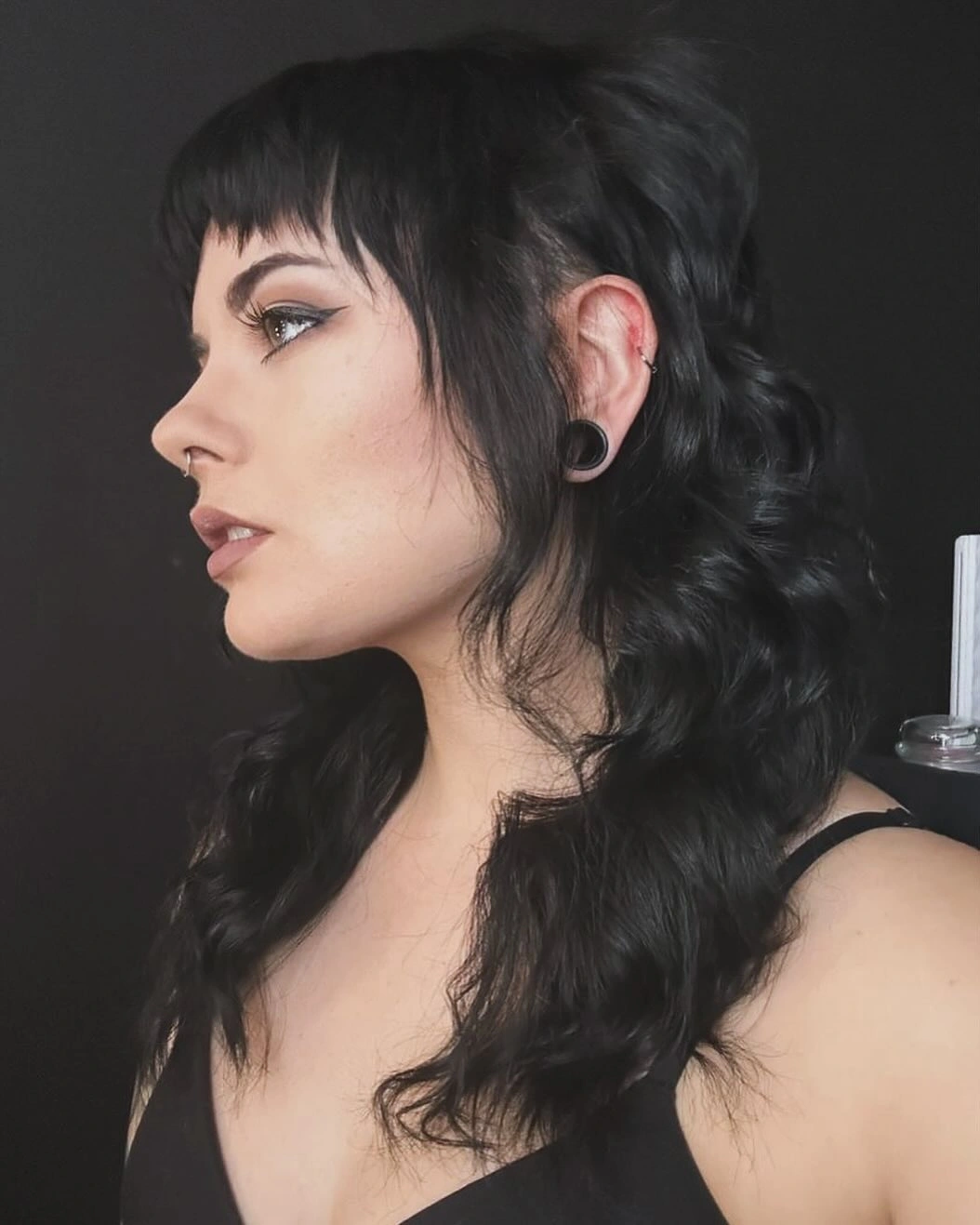 Dark profile shag with short fringe and long wavy back