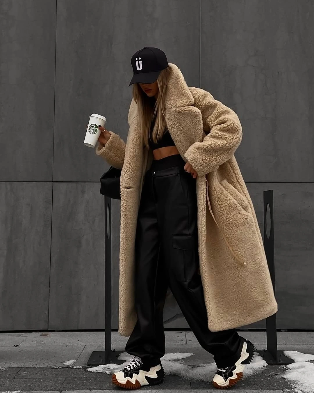 Beige teddy coat with black cap and wide pants