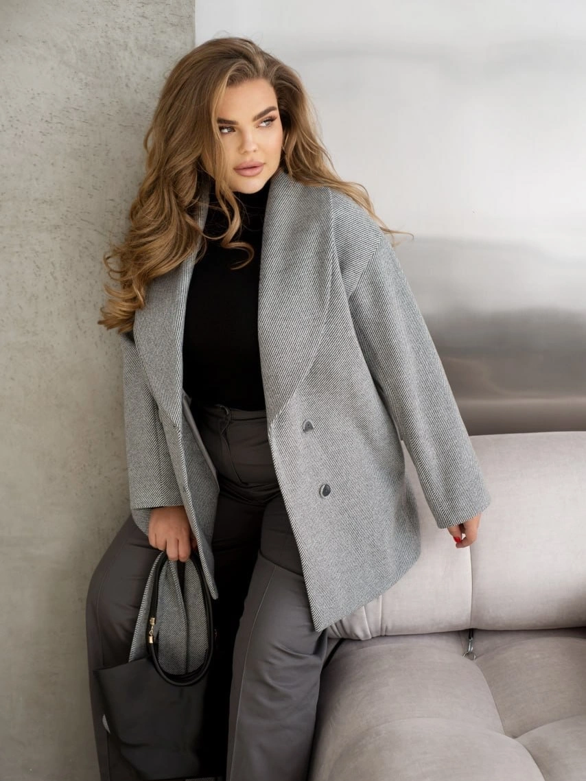 Gray blazer coat with black turtleneck and tote