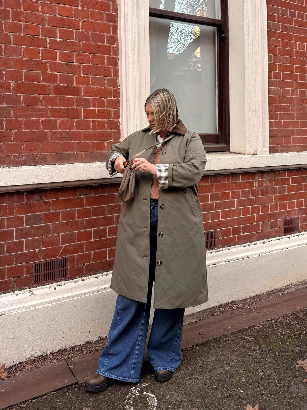 Olive coat with wide jeans and chunky shoes