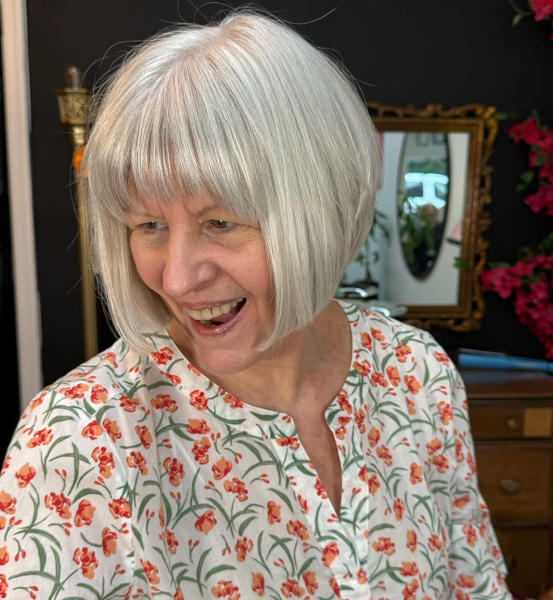 Straight silver bob with full fringe and curved chin-length perimeter