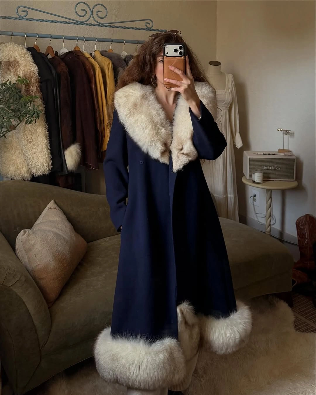 Long navy coat with oversized cream furry-looking trim
