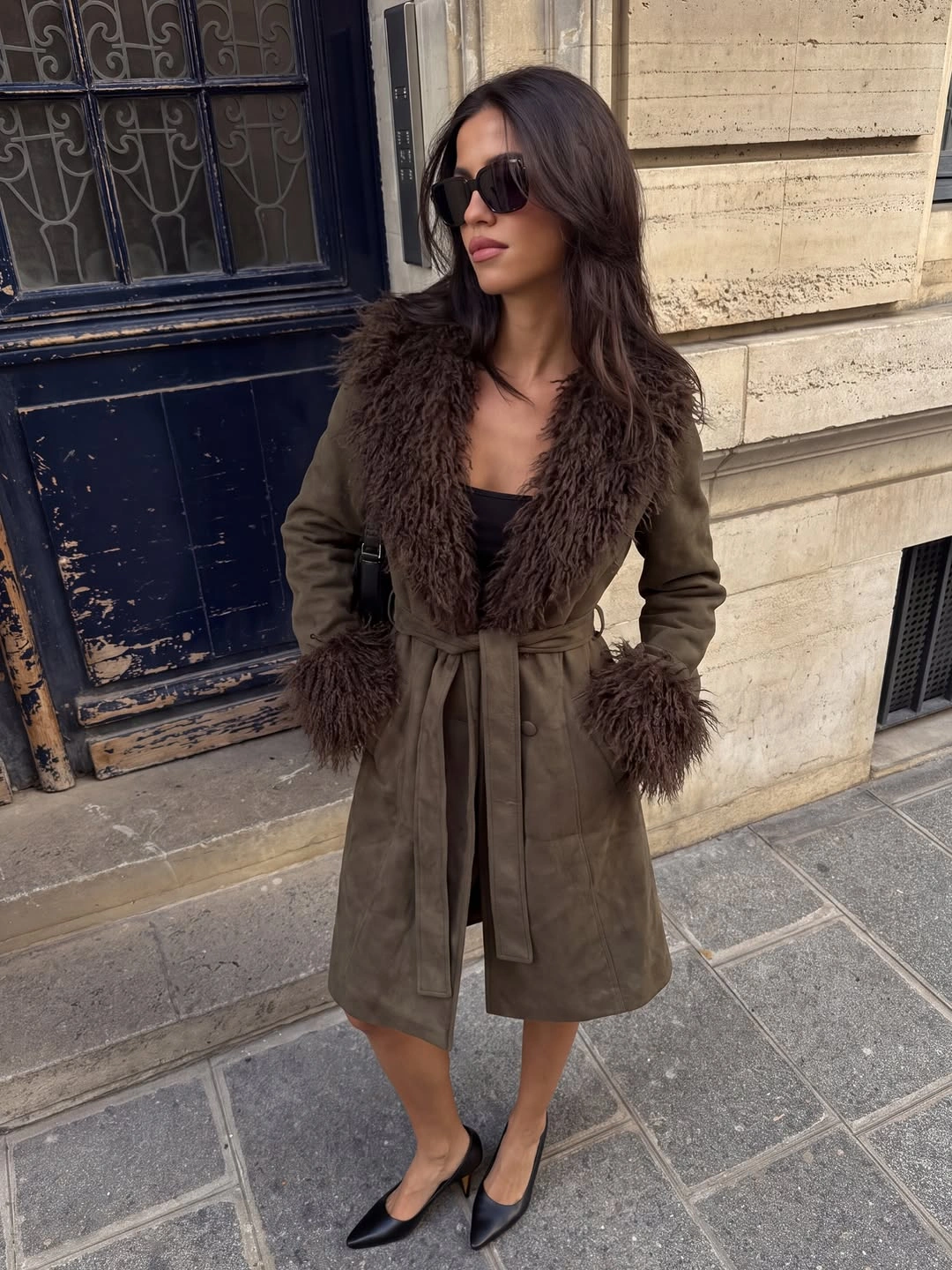 Belted olive-brown coat with dark furry-looking trim