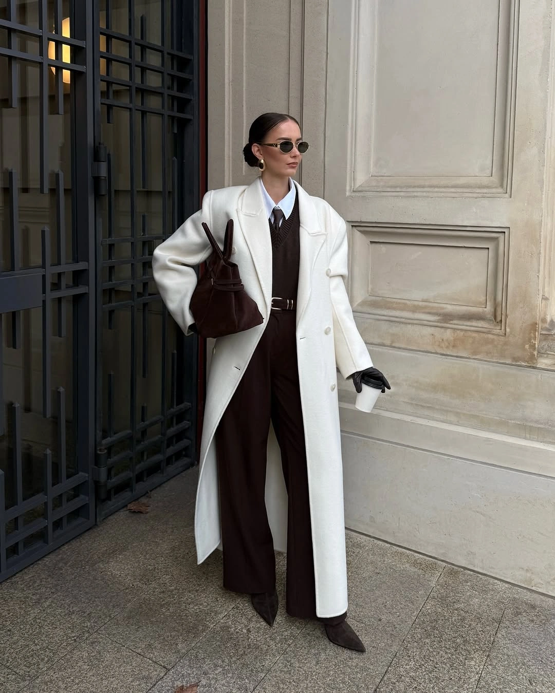 Long white coat over dark brown tailored layers