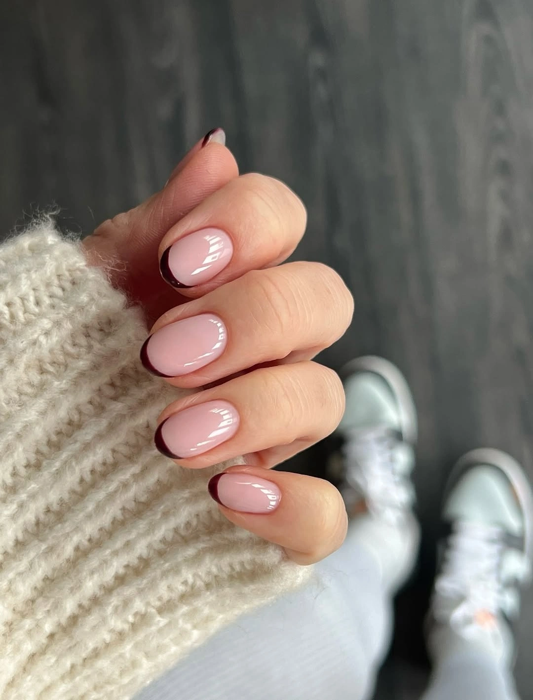 Nude pink short nails with thin burgundy micro tips