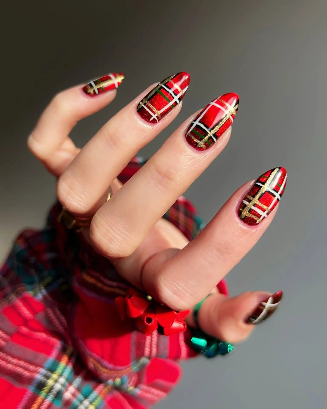 Long almond red plaid nails with black green and gold lines