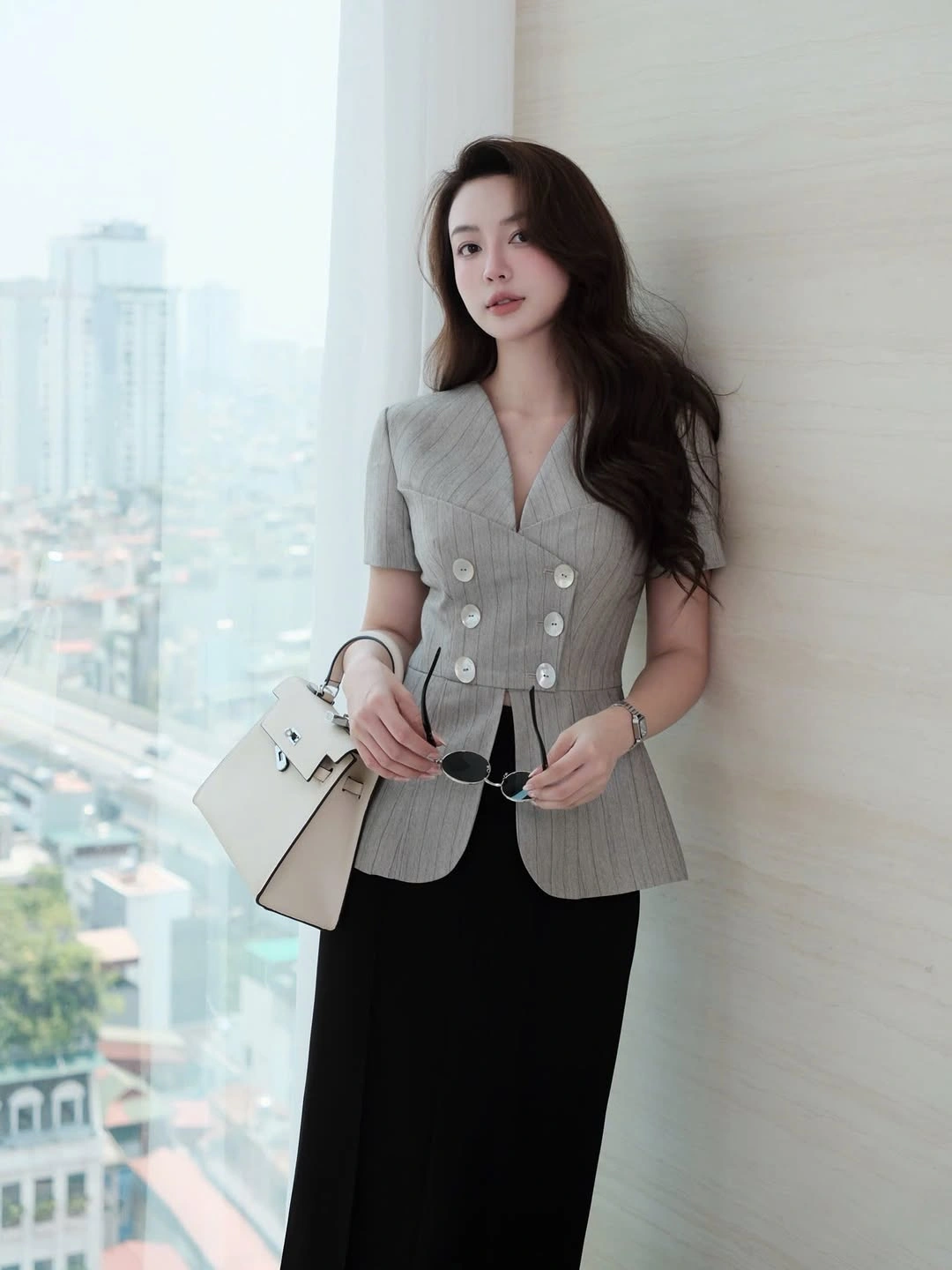 Gray short-sleeved buttoned top with long black lower half